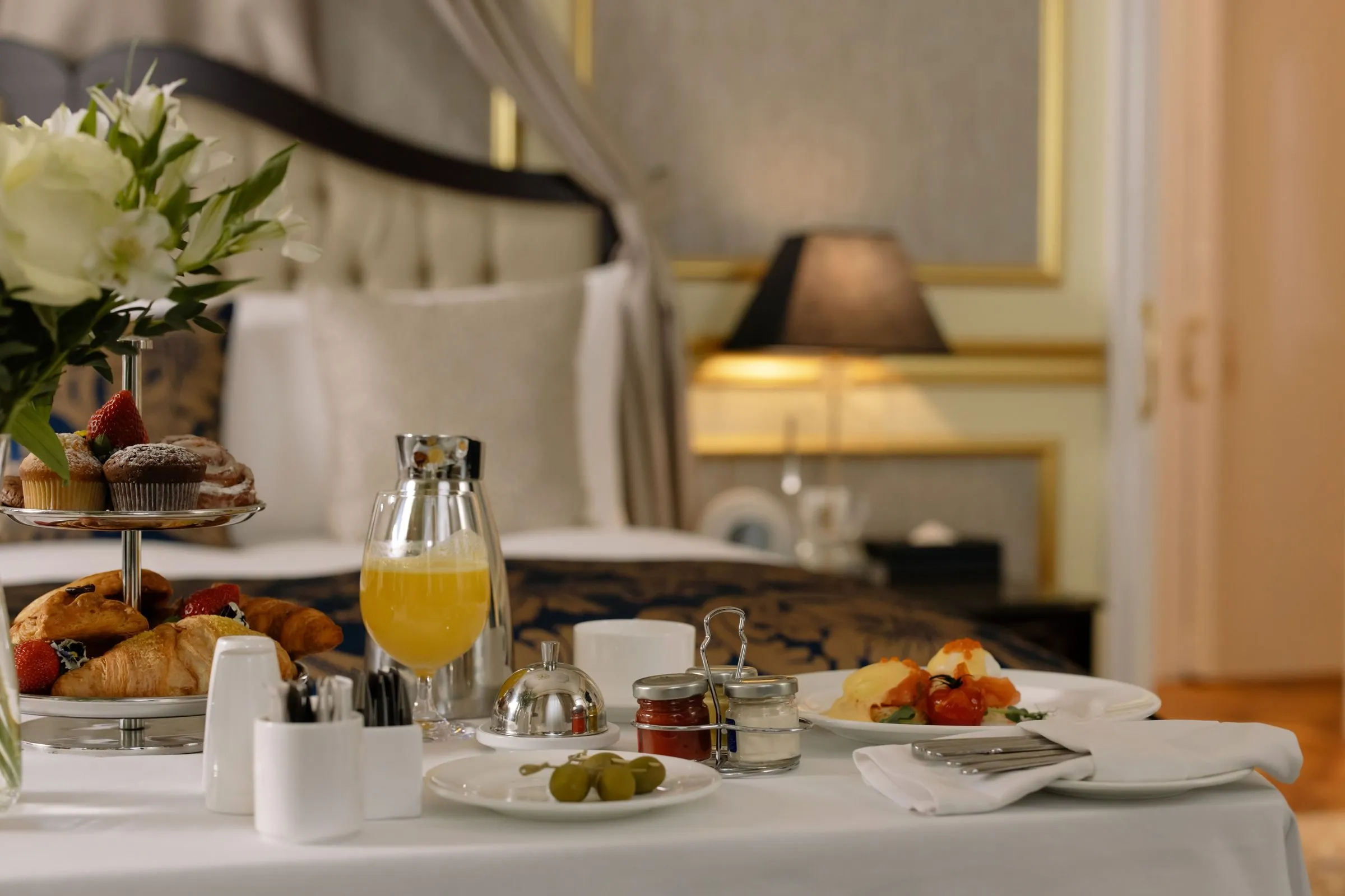 Breakfast on a tray: pastries, orange juice and coffee
