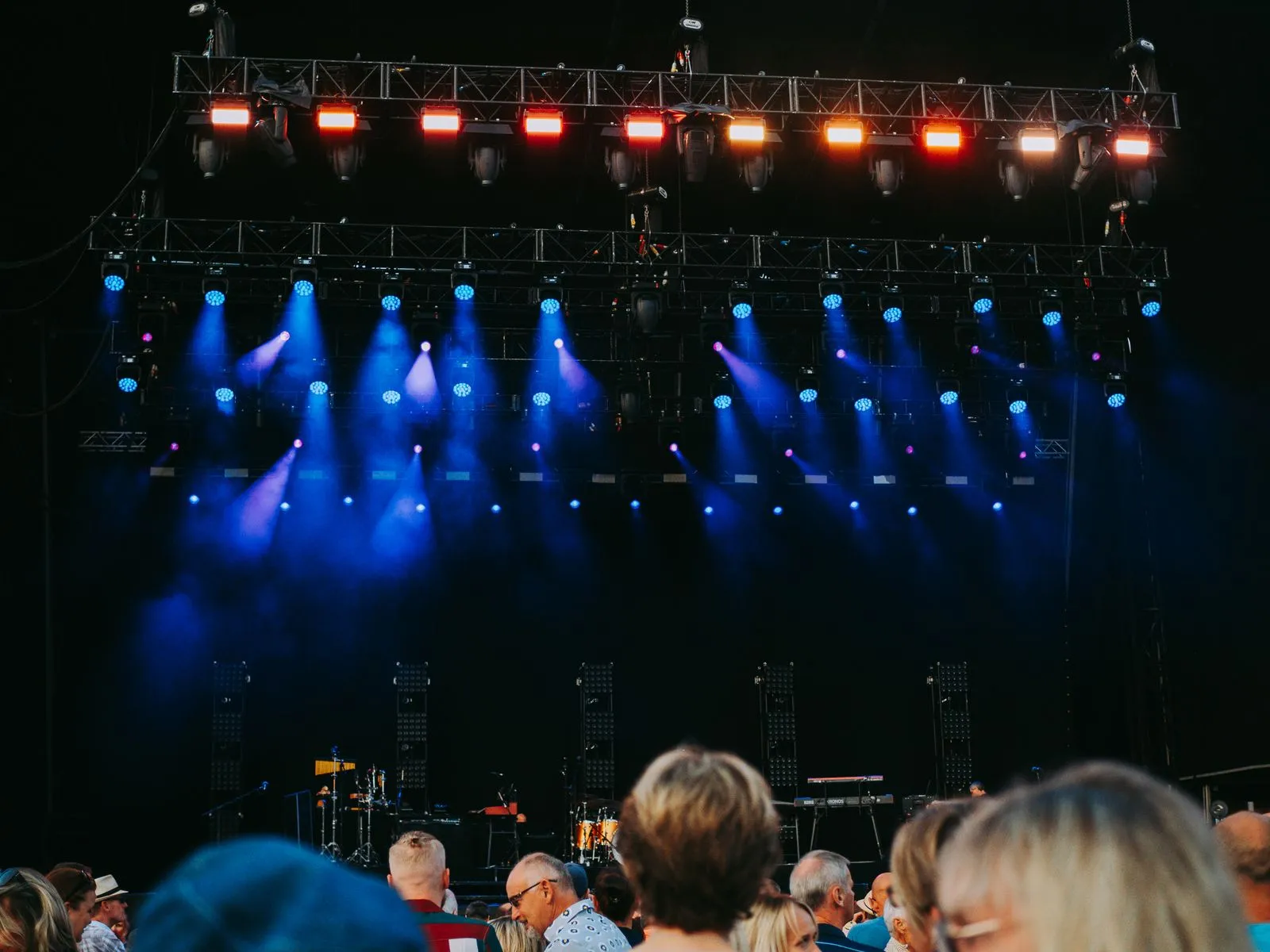 Stage lights rigged above the crowd